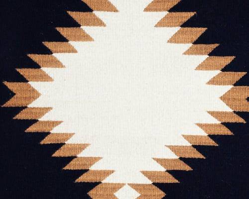 The Sierra rug is made from premium soft wool and boast a bold traditional pattern that reflects the heritage of the makers who created it. Hang on the wall as an art piece or add it as a rug to bring a room together with soft, organic tones. This rug is made of a combination of undyed and natural dye wool fibers and handmade on a traditional pedal loom in a rural weaving village. Making it both a conscious, high quality, and timeless piece for your home.