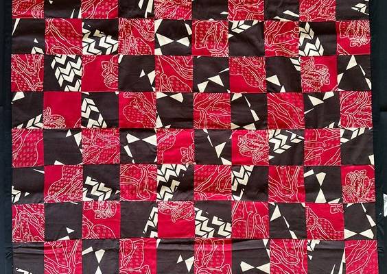 Red and Dark Brown Sig Zane Print Quilt top 2 layers of 100% cotton Black Backing approx size 42