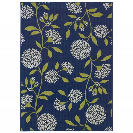 This highly durable Indigo Blue and Lime Green Floral Rug is a striking look with the trend-forward shades of indigo, and lime green in a beautiful pom pom floral design. Machine made of an easy care nylon polypropylene mix, this rug is not only good looking but naturally stain resistant and wipes off with a spray hose. Full of texture and pops of bright color, this rug is high-style, and offers high durability that is perfect for the outdoors or for any room in the home.