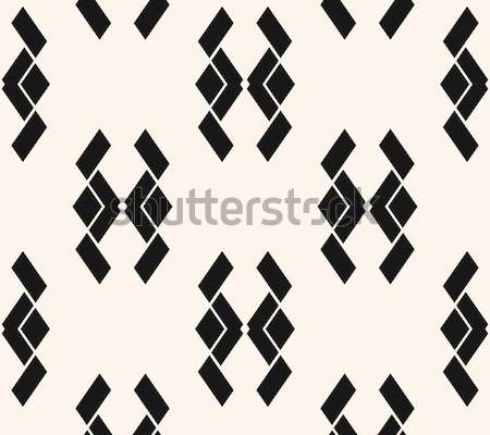 Vector abstract geometric seamless pattern. Black and white ornamental texture with rhombuses, rectangles, simple animal silhouettes. Tribal ethnic motif. Simple monochrome background. Repeated design