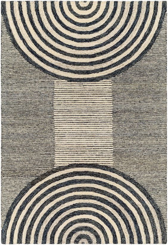 Bold geometric patterns make the Granada 30860 area rug an instant focal point for any interior environment. This dashing area rug is handcrafted by the skilled artisans at Surya, every detail thoughtfully considered for long-lasting appeal in any setting. Durable construction makes Granada collection rugs ideal for homes shared with pets and children. This is a family-friendly design suitable for spaces that experience moderate to heavy foot traffic. Contrasting concentric circles decorate each