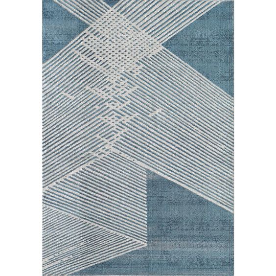 The Vista contemporary geometric area rug features criss-crossing parallel lines across the entire length of the warm blue backdrop. The neutral ivory color of the parallel lines is reminiscent of a warm day at the beach, bringing this relaxation and charm with it. Like the famous art-deco art style of decades past, this is the perfect addition to any fashion-forward home. The elegant geometric design is perfect for any modern space, whether you use this area rug in your living room, bedroom, or