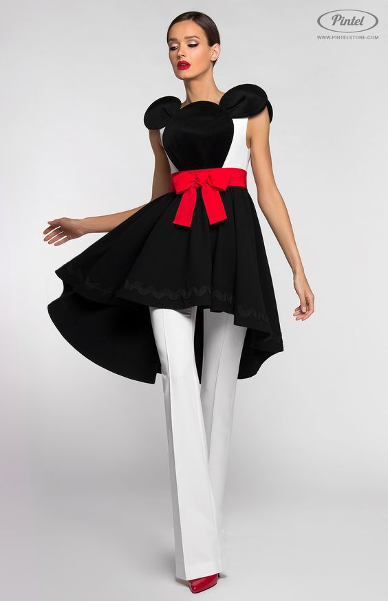 Combined black and white suit. Asymmetric slim-fit sleeveless dress. Decorated with Mickey cotton velvet application in front. Fixed belt with decorative cotton ribbon bow. Without pockets. Hidden back zip closure. Flared pants with side zip closure. Without pockets. On the photo: model is wearing a size S and is 180 cm.