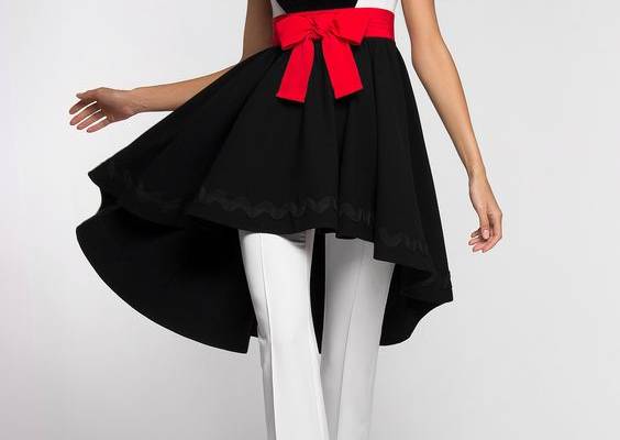 Combined black and white suit. Asymmetric slim-fit sleeveless dress. Decorated with Mickey cotton velvet application in front. Fixed belt with decorative cotton ribbon bow. Without pockets. Hidden back zip closure. Flared pants with side zip closure. Without pockets. On the photo: model is wearing a size S and is 180 cm.