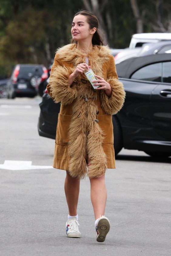 Between her penchant for archival fashion and her almost absurd workout fits, Rae has the makings of a fashion star. Tap to see more.