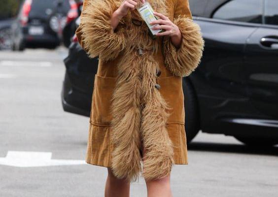 Between her penchant for archival fashion and her almost absurd workout fits, Rae has the makings of a fashion star. Tap to see more.