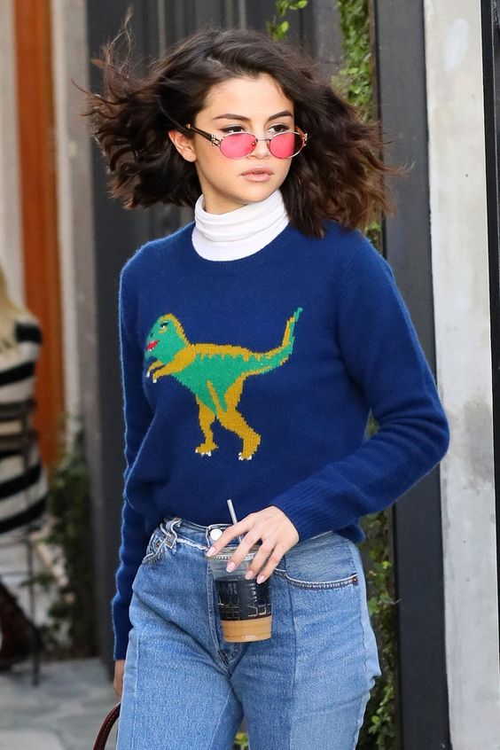 The singer, actor, and Rare Beauty founder demonstrates an approach to fashion that is both playful and seductive. Tap. to see more.