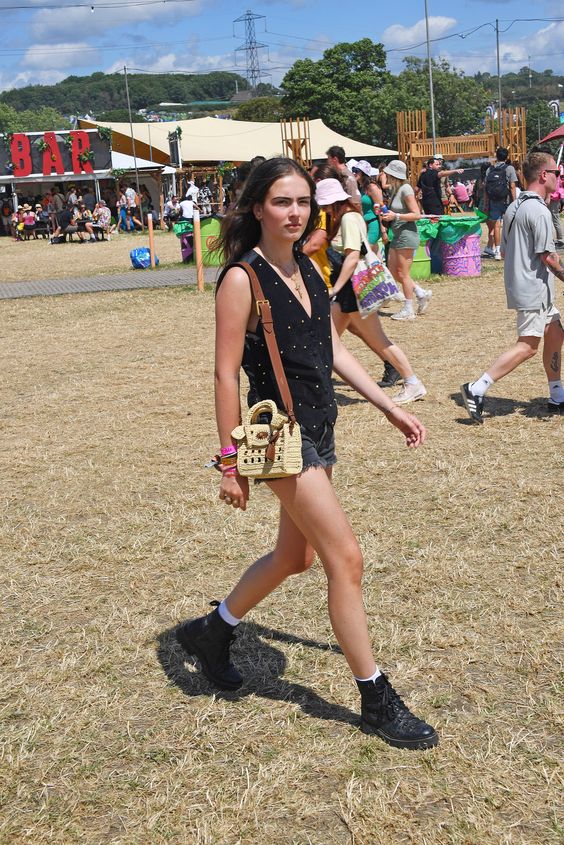 Think designer denim and trophy bags over neon and flower crowns. Tap to see more.