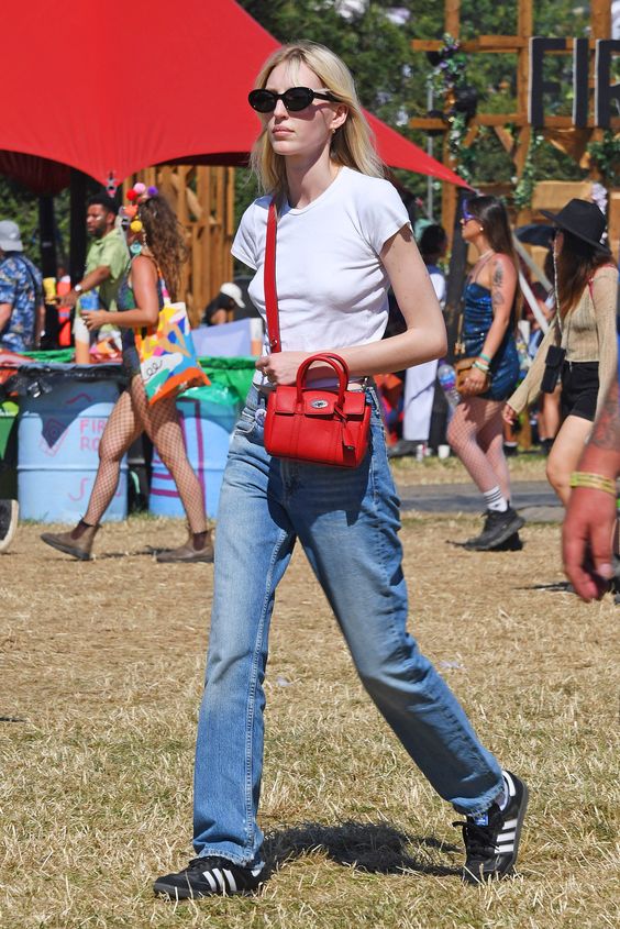 Think designer denim and trophy bags over neon and flower crowns. Tap to see more.