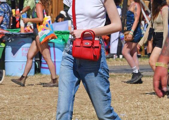 Think designer denim and trophy bags over neon and flower crowns. Tap to see more.