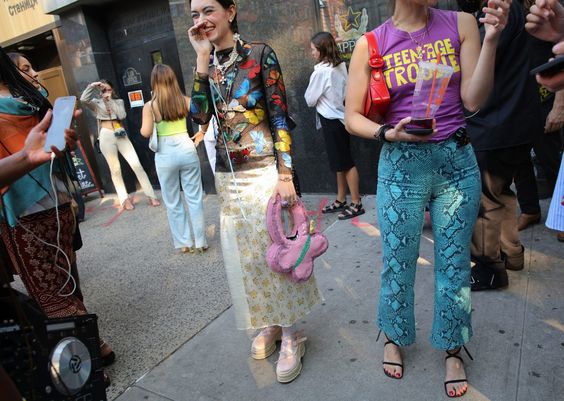 From color-blocking and clashing prints to dresses layered over pants, these street-style looks felt newly experimental. Tap to see the best looks.