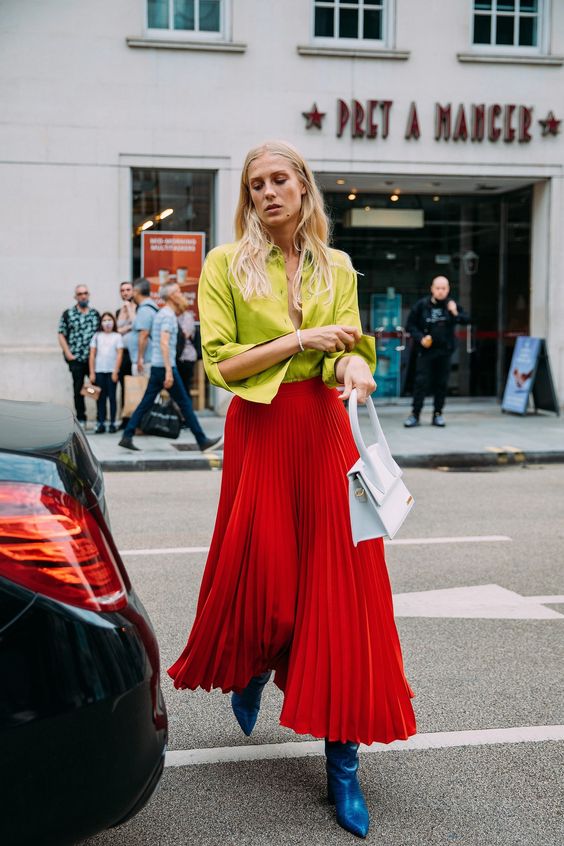 From color-blocking and clashing prints to dresses layered over pants, these street-style looks felt newly experimental. Tap to see the best looks.