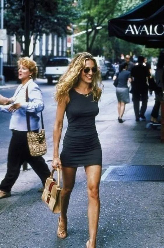 Discover the best Carrie Bradshaw outfits and fashion investments from Sex and the City. Tap to see more.