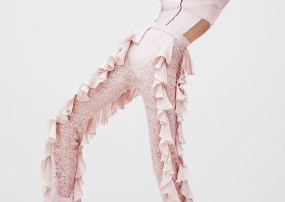 Looking pretty in pink, Sasha Luss models Balmain top and ruffle-decorated pants
