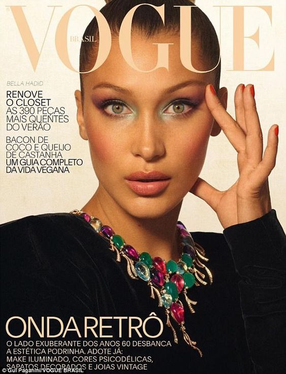 Bella Hadid shows off her model figure in a sheer pink lace bodysuit