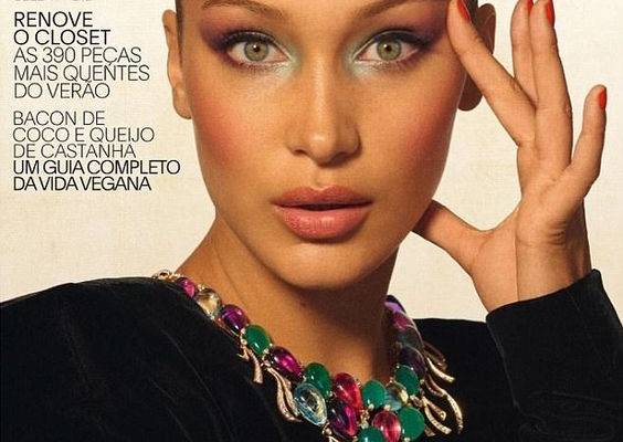 Bella Hadid shows off her model figure in a sheer pink lace bodysuit