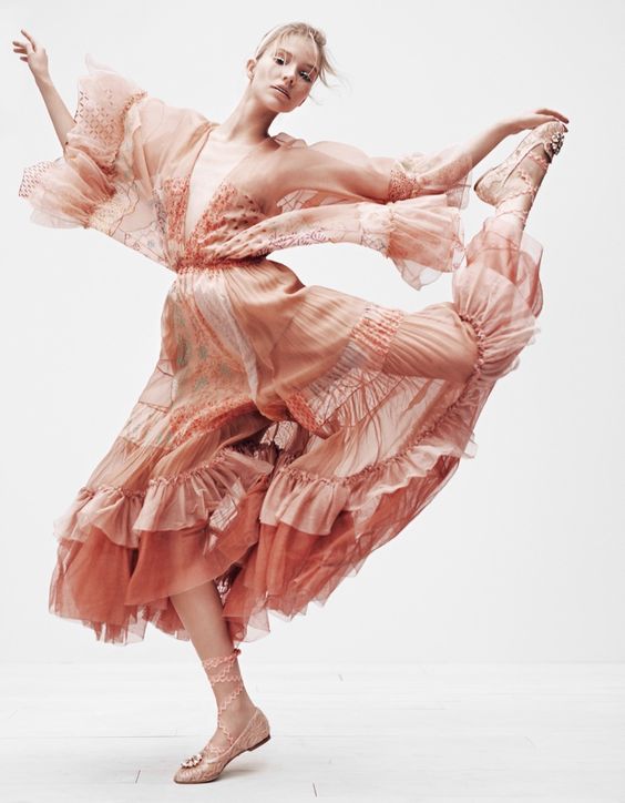 Taking a leap, Sasha Luss models printed dress