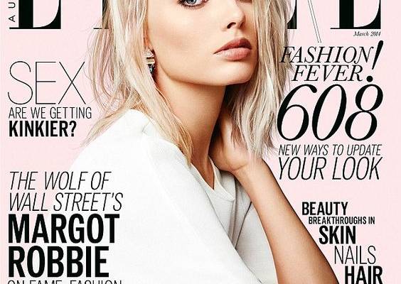 Margot Robbie stuns in a sheer scarlet gown for high fashion shoot