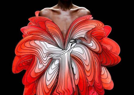 iris van herpen uses laser cutting techniques to create 3D anamorphic couture