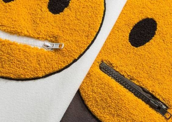 DESCRIPTION Our one of a kind Harajuku Style Secret Smile hoodie features a large smile logo patch on the front, smaller patches on the sleeves, and decorative zippers to take your outfit to the next level! This hoodie is made of only the highest quality material and has thickness to it guaranteed to keep you warm and cozy throughout it's whole lifetime, shop now and take advantage of our free shipping and 30 day money back guarantee! DETAILS Materials: premium cotton, polyester, wool Soft fleec