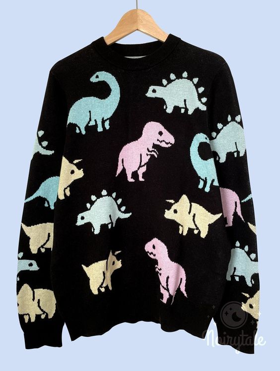 Shipping from USA! Please read about sizing below. Channel your inner fairy-kei with this adorable pastel dinosaur sweater knit pullover that’s an essential for the season. Pair it with a cute skirt and boots, or tucked in the front in jeans with a crossbody bag. This design was really popular for the switch skins we had so we decided it would look super adorable as a sweater. :) Comes in two colors: Lavender Purple and Black ★ Embroidery designs on chest an ★ 100% cotton ★ Size is currently one