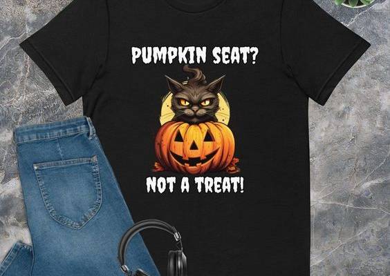 This grumpy cat has a message: 'Pumpkin seat? Not a treat!' 🎃🐱🙅‍♀️ Share the humor this Halloween with our unique shirt. Click to learn more and add a touch of feline mischief to your style! 👚