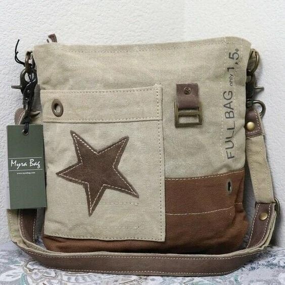 💖NEW Myra Bag Vintage STAR Canvas Shoulder Bag Leather Purse💖FREE SAME DAY SHIPPING IN USA💖Canvas and Leather💖Exterior: Front pocket; Back zipper pocket💖27″ shoulder drop💖Interior: zipper pocket💖Made from Upcycled materials💖Measures 11″ W x 10.5″ H x 1″ DCONDITION: NEW Canvas Bag Shop smoke free pet free environmentBecause each bag is beautifully artisan handcrafted, occasionally but not frequently, colors could be half a shade – or   than what is pictured.  The dimensions will NOT mater