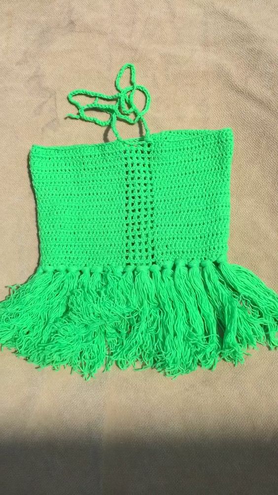 Crochet crop top with fringe perfect for festivals and vacations.