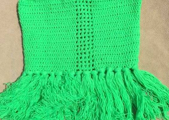 Crochet crop top with fringe perfect for festivals and vacations.