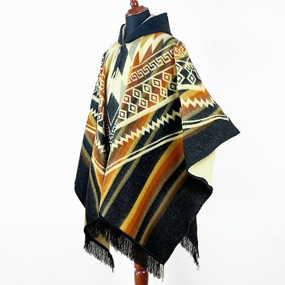 see other items AUTHENTIC FAIR TRADE PRODUCTS FROM ECUADOR Buy more items and save! Take a look on our SPECIAL OFFERS! Special Offers Tracked Shipping Top Quality Alpaca wool Unisex Hooded Poncho Aztec pattern This is a brand new unisex poncho, made of alpaca wool yarn.  It is very light, extremely soft, warm, very soft to touch and won’t itch.    One Size (approx.): 56″ x 34″ / 143 cm W x 86 cm H incl. fringe   Material: Alpaca Wool blend   Colour/pattern could vary slightly from the photo.   W