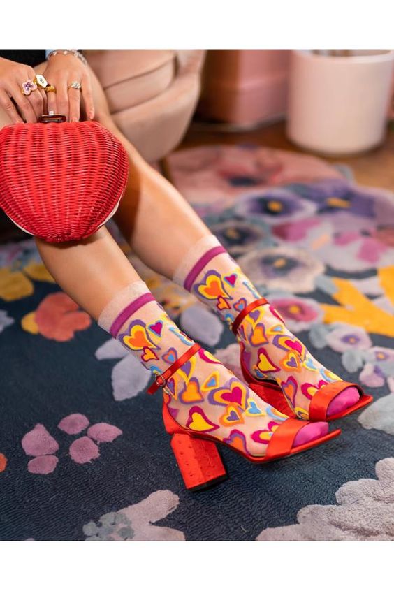 From theSock Candy x Dunn-Edwards Trends Holiday Collection.Follow your heart to fashion bliss with these sheer white Y2K style heart socks featuring multi-colored hearts and butterflies. Finished with a white ruffle cuff. With juicy, passionate colors from the Dunn-Edwards 2023 Trends Story Live in Joy, your feet will set hearts aflutter wherever you go.One Size.Recommended fit US W5.5-10. 200 Needle Count.Funky yet elegant – no silly or childish patternsPremium quality – durably made with comf