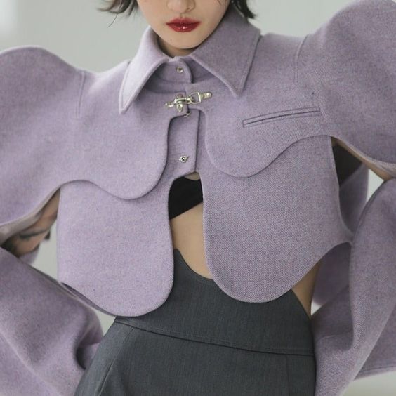 Noone Collection is all about pushing the boundaries of street, avant-garde, and trendy fashion. This Petal jacket is a fashion-forward take on a bolero, with curvy cuts and interestly placed cutouts. It can also be combined with the midnight blue version of this jacket and make it a two-tone look. Material: CottonMaterial: PolyesterStyle: Fashion ForwardCollar: Turn-down CollarClosure Type: Single BreastedSleeve Style: RegularSleeve Length(cm): FullType: LOOSEOuterwear Type: Wool