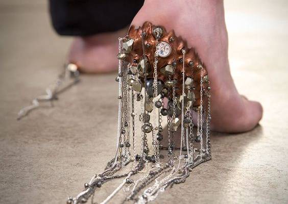 ﻿﻿Archival print on museo paper Overall dimension with matte - 30” x 26” Image: 24” x 16” Protector reflects on man’s desire to leave something behind, the need to make a mark on the world, and create a heritage and protect loved ones even after he is gone. The heal of the foot is blistered with copper, compass, hematite and pyrite gemstones, leaving a trail of sterling silver chain. From the Lick series, portraying human as sculpture – a multi media project documenting wounds and the potential