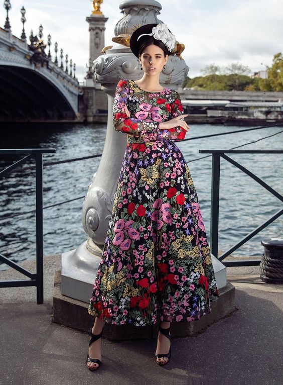 This particular cocktail dress is both elegant and whimsical. Colourful embroidery from the neckline down to the bottom of the skirt adds a touch that is both elegant and edgy. The lining is made of natural silk and can be chosen as either a skirt or shorts. This unique, gorgeous floral evening maxi dress offers a colourful, artsy alternative to your formalwear wardrobe. Additional Information  Description Polyester on Nylon mesh The underparts made of 100% Silk: undershirt, shorts, skirt (60 cm