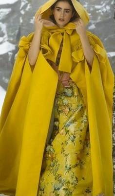 Lily Collins as Snow White in her yellow cloak. 'Mirror Mirror' (2012), Costume Designer: Eiko Ishioka-- Cute inspiration but would have to be shorter and less...Dramatic. Perfect for future strolls down Hawthorne!