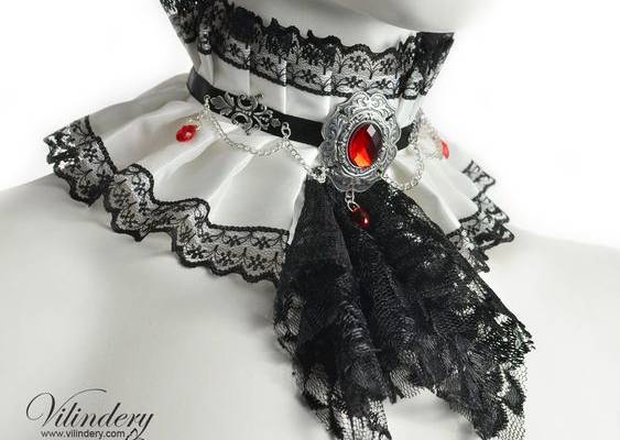 Choker is adjustable with long black satin ribbons from the back. Minimal neck size is 11.2