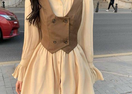 Vintage Double Button Vest Ruffled Dress Set Step back in time and embrace the elegance of vintage fashion with this enchanting dress set. Featuring a double-button vest and a ruffled skirt, this exquisite ensemble exudes charm and sophistication. Features: Vintage-inspired design with delicate ruffles Double-button vest for a tailored look Soft and breathable fabric for all-day comfort Flattering silhouette that accentuates your curves Versatile style for both casual and formal occasions Availa