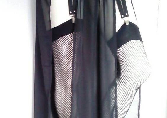 Vegan leather front panel chiffon maxi garter skirt. Embellished with studs and chains. The back panel is elastic. The skirt is made from sheer chiffon fabric. Front fabric is removable.Skirt ( without the waist band ) is approximately 90cm long..if you need longer or shorter skirt ,leave a note under your order