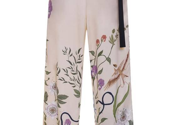 For their latest collection, Colombia’s authority on botanical-strewn romance returns with fresh references, added texture, and reimagined silhouettes. Alongside their signature hyper-feminine dresses and matching sets, pieces come alive with quilted fabrics, intricate florals, fringe, and the rich embroideries that first propelled the brand to fame. These high-waisted pants have a wide leg silhouette and waist ties. Pair with the [matching blouse](https://www.modaoperandi.com/women/p/agua-by-ag