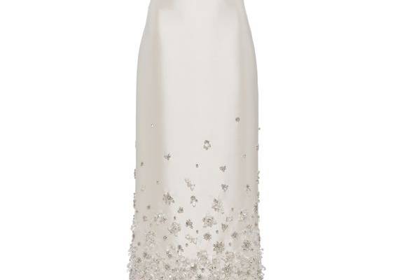 Sheath silhouette Lined garment Back slit Back zipper closure Knit logo label