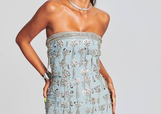 Set your style apart on your next outing with our Linez Embellished Denim Dress. This pastel blue ensemble features delicate crystal trimmings, 3D floral-designed embellishments, and mini triangular hemmed cutouts that create a whimsical fashion statement sure to become your eveningwear go-to. Seal the deal with our equally illuminating Alphabet Earrings in Silver. Shown here in Light Wash Denim. HANDMADE 100% Cotton Made in India Model is 5'10