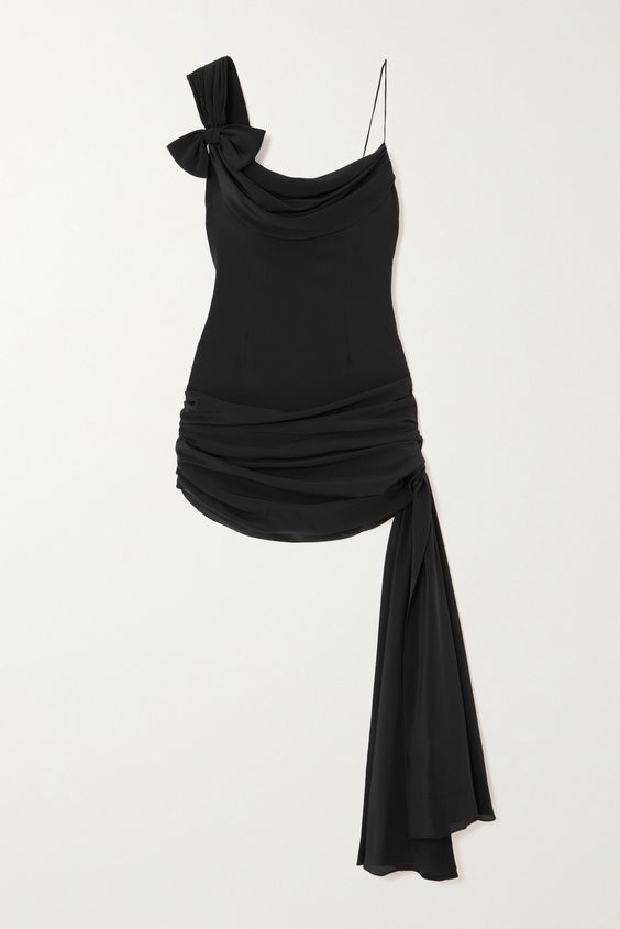 Alessandra Rich’s clothing is designed to make you feel confident and beautiful. Seen on the Fall ’23 runway, this mini dress is cut from silk-chiffon that falls to a gathered hem with a wispy trailing trim. One shoulder is adorned with a dainty bow, playing into the collection’s boudoir inspiration.