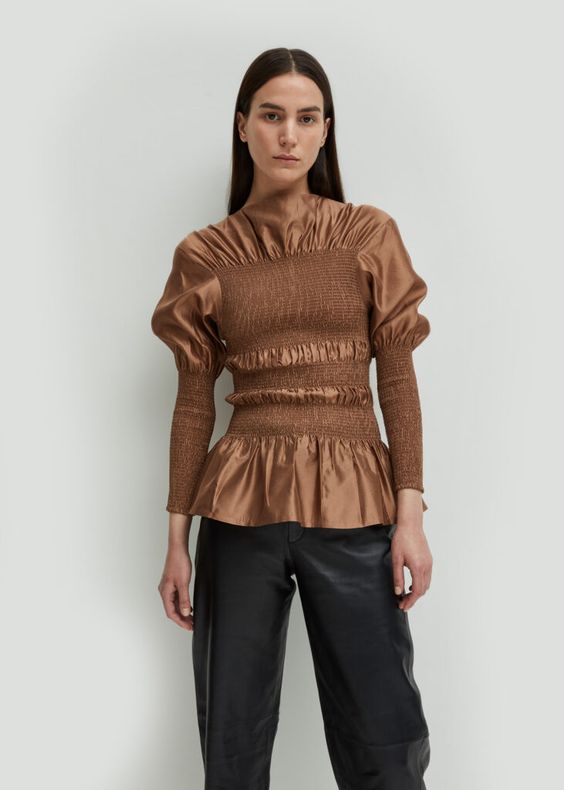 Coripe is our draped evening blouse, made with luxurious silk. It has a boat neck, smocking details at the front and sleeves, and a beautiful draping below the collar. Team with Novara leather trousers to cocktails or dinner.