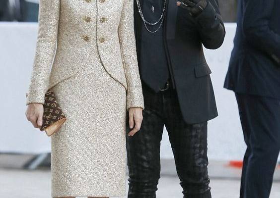 Michelle Williams shows off her slim legs in make-up print mini dress