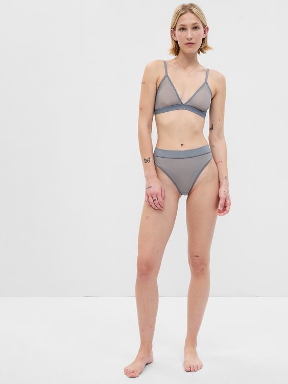 Ultrafine stretch mesh.  V-neckline.  Adjustable straps.  Hook closure at back.  For more fit and sizing info, check out our Size Guide.